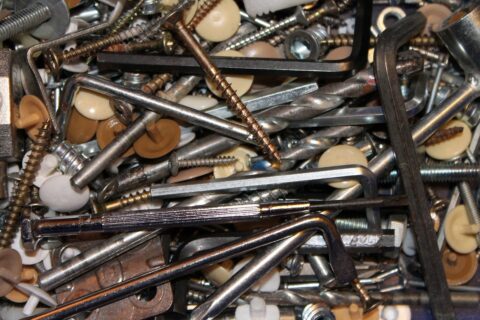 An unsorted selection of Allen Keys, screws and brackets.