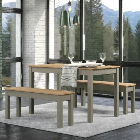 Large dining set with table and 2 benches, grey and pine. Placed in a corner with large windows at each elevation.