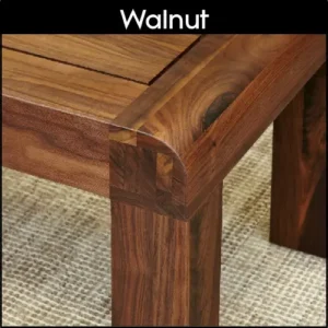 Corner detail of a walnut coffee table showing the various grains meeting.