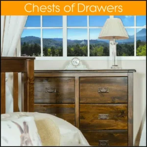 A large dark wood chest of drawers underneath a window with a panoramic view.