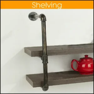Close up of a wall shelf that is made from pipe and pipe joints. The 2 shelves are wood and there is a red teapot on the bottom shelf.